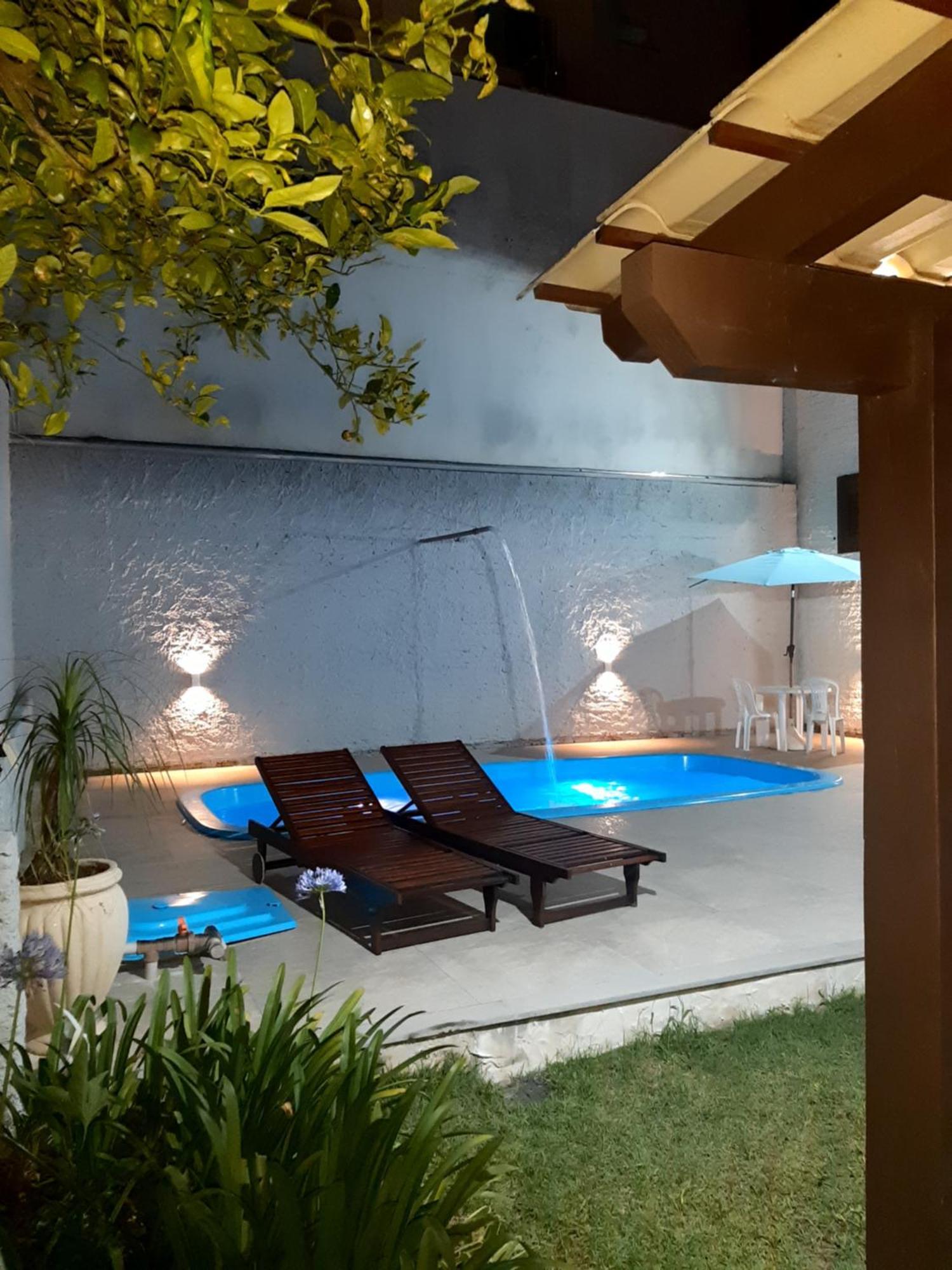 Casa ÍSIS de aluguel por temporada em Capão da Canoa com piscina Exterior foto