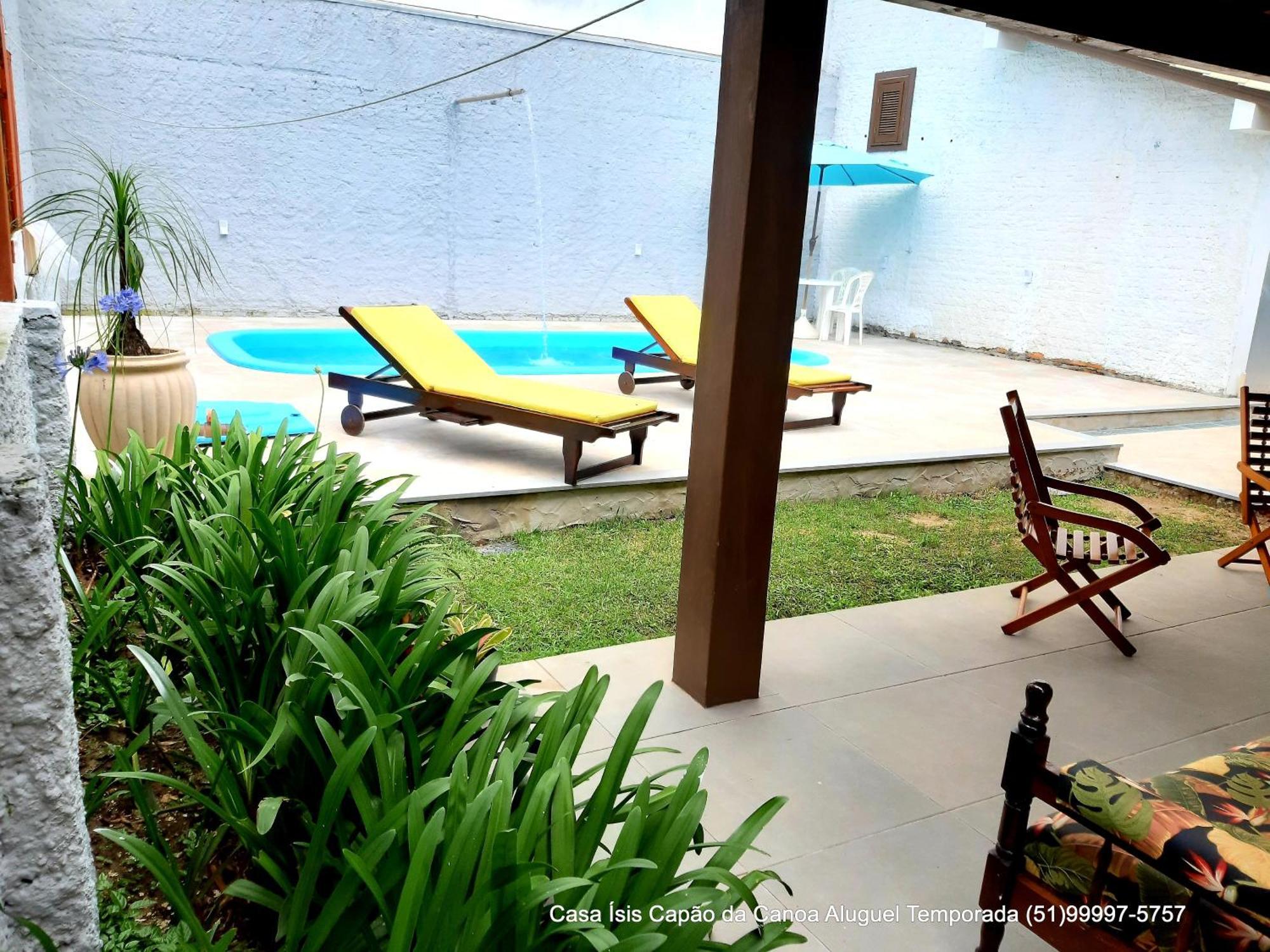 Casa ÍSIS de aluguel por temporada em Capão da Canoa com piscina Exterior foto